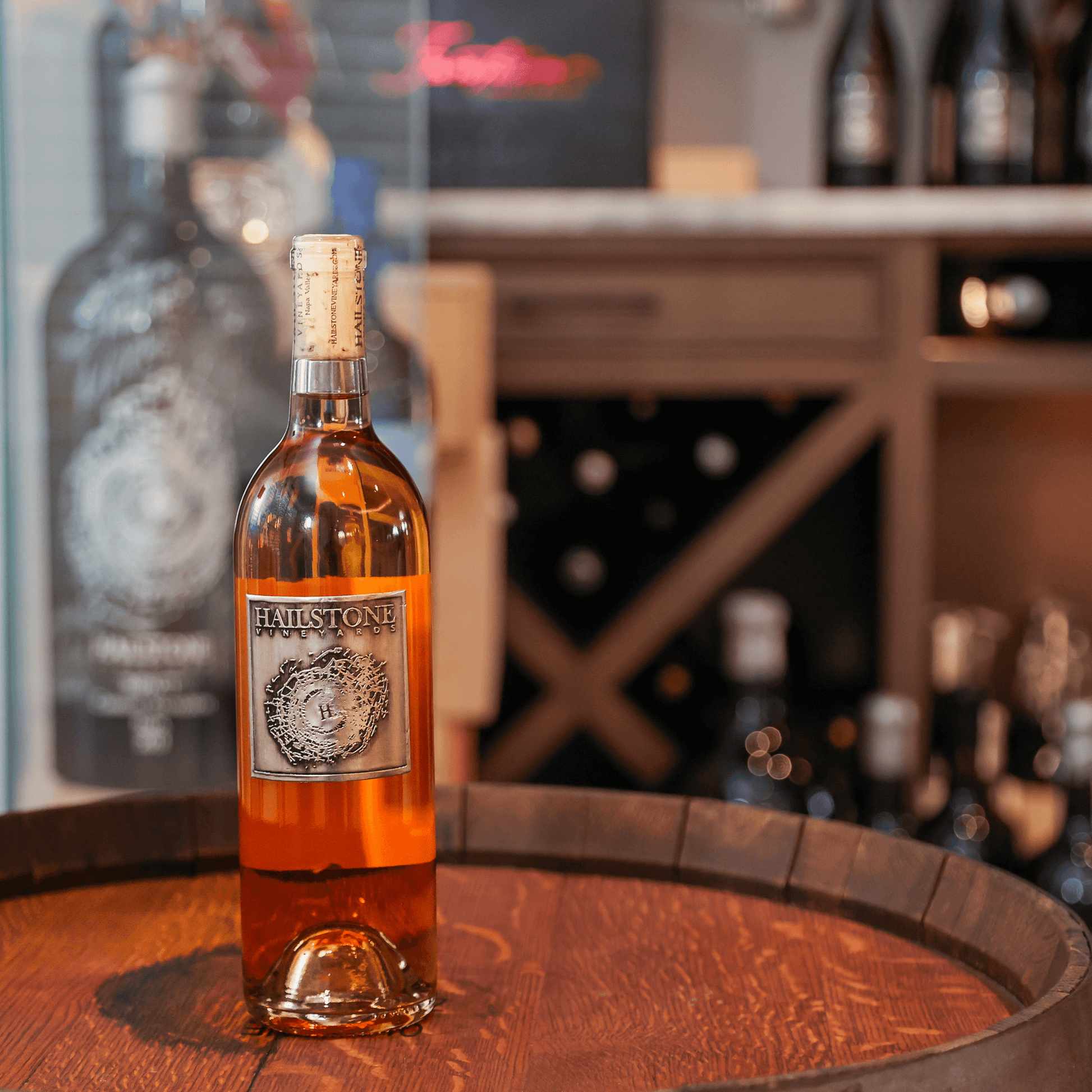 Weather Dancer Dry California Rosé Bottle on a Wood Table