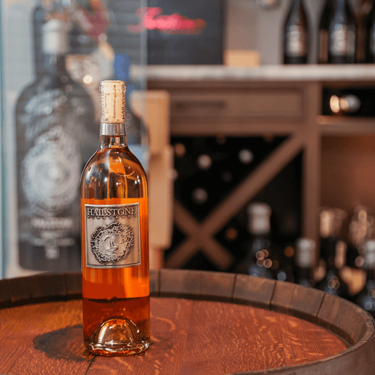 Weather Dancer Dry California Rosé Bottle on a Wood Table